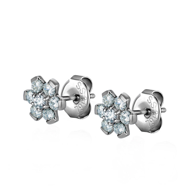 Boucle d'oreille fleur blanche en acier et zircons