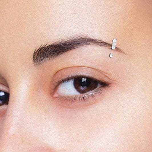 Piercing arcade or blanc avec quatre brillants