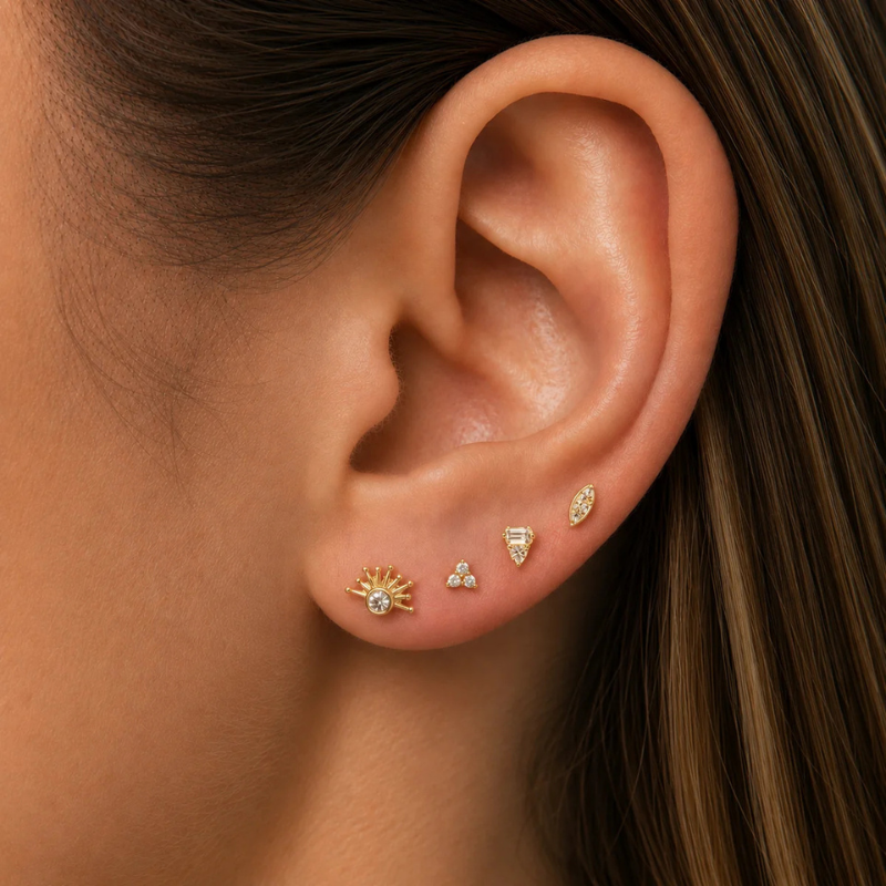 Boucle d’oreille soleil SOLÉA en argent 925 doré portée au lobe